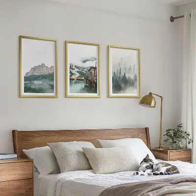 Set of 3 framed wall art pieces featuring mountains, a lake, a cottage, and fog