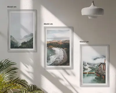 Set of 3 framed wall art pieces featuring mountains, beach, clouds, and water