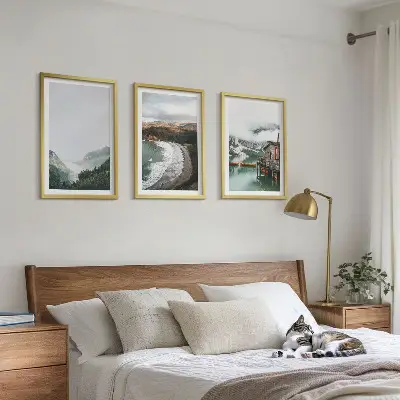 Set of 3 framed wall art pieces featuring mountains, beach, clouds, and water