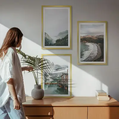 Set of 3 framed wall art pieces featuring mountains, beach, clouds, and water