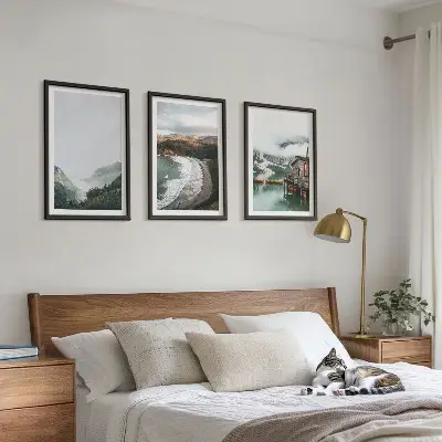 Set of 3 framed wall art pieces featuring mountains, beach, clouds, and water