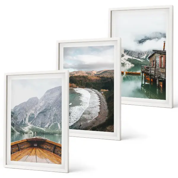 Three-piece wall art set featuring a landscape of a mountain lake with a boat and beach