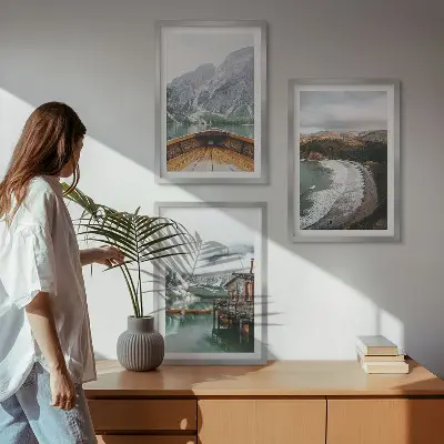 Three-piece wall art set featuring a landscape of a mountain lake with a boat and beach