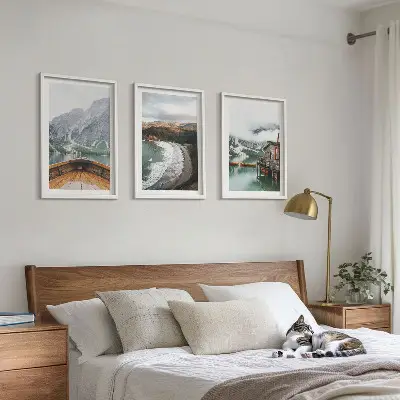 Three-piece wall art set featuring a landscape of a mountain lake with a boat and beach