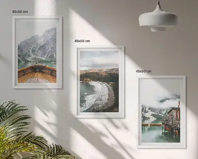 Three-piece wall art set featuring a landscape of a mountain lake with a boat and beach