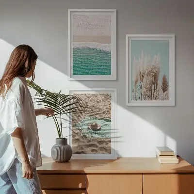Set of 3 framed wall art pieces featuring a beach with waves, grass, and a hat