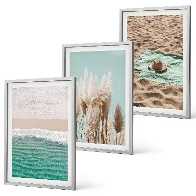 Set of 3 framed wall art pieces featuring a beach with waves, grass, and a hat