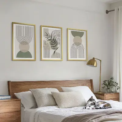 Three-piece wall art set with abstract shapes and greenery