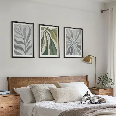 Set of 3 framed wall art pieces featuring green plant patterns