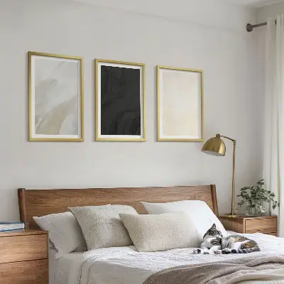 Set of 3 framed wall art pieces featuring structures in minimalist shades