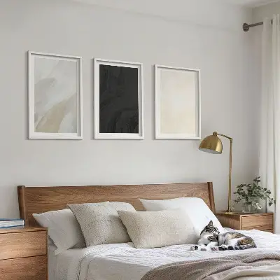 Set of 3 framed wall art pieces featuring structures in minimalist shades