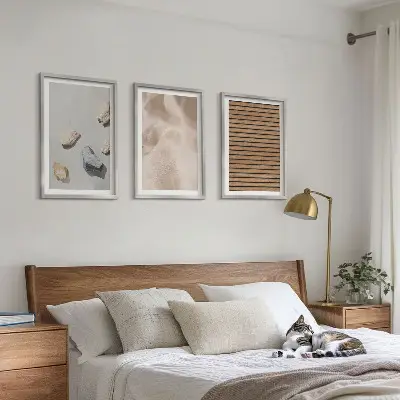 Three-piece wall art set with stones, wood, and fabric textures