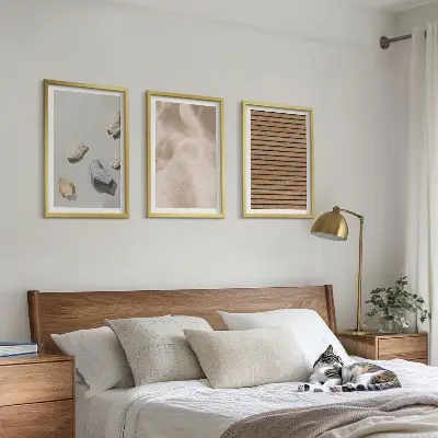Three-piece wall art set with stones, wood, and fabric textures