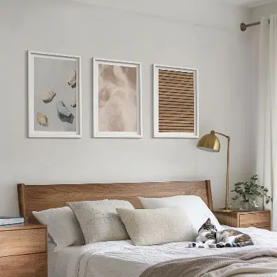 Three-piece wall art set with stones, wood, and fabric textures