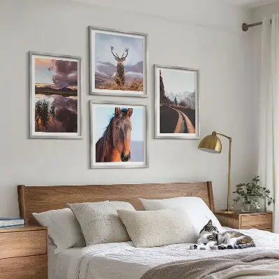 Set of 4 wall art pieces featuring mountain landscapes with reindeer and horse road scenes