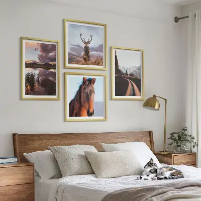 Set of 4 wall art pieces featuring mountain landscapes with reindeer and horse road scenes