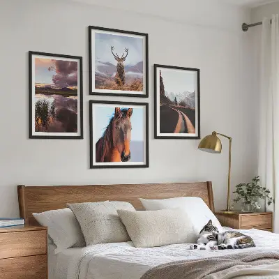 Set of 4 wall art pieces featuring mountain landscapes with reindeer and horse road scenes