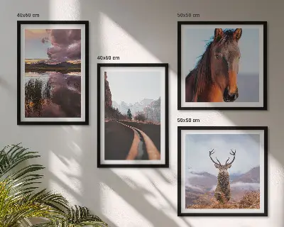 Set of 4 wall art pieces featuring mountain landscapes with reindeer and horse road scenes