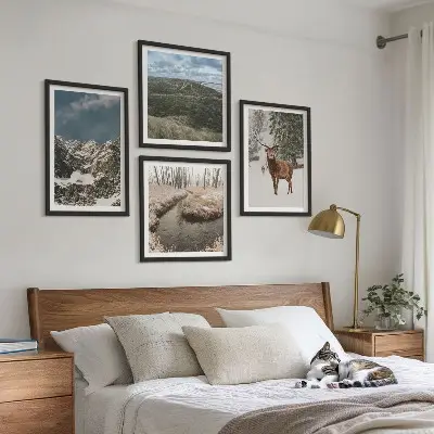 Set of 4 wall art pieces featuring mountain snow, deer, and forest landscape
