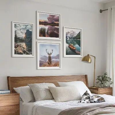 Wall art set featuring a mountain lake with a boat at sunset and a deer
