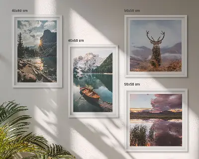 Wall art set featuring a mountain lake with a boat at sunset and a deer