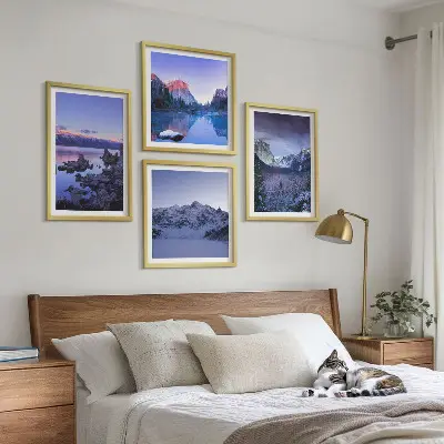 Multi-piece mountain landscape wall art set featuring a sunset over water