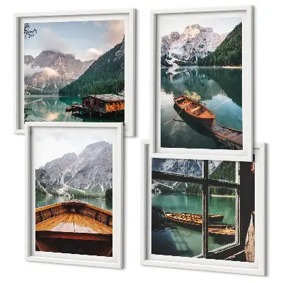 Set of 4 wall art pieces featuring a lake with mountains, boats, and a cottage window view