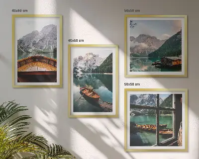 Set of 4 wall art pieces featuring a lake with mountains, boats, and a cottage window view