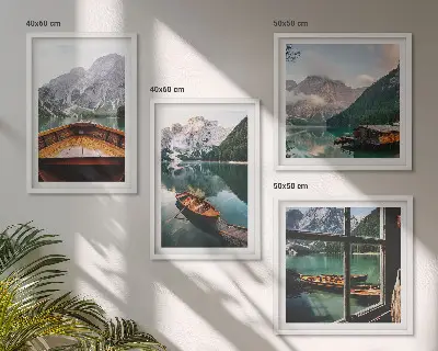 Set of 4 wall art pieces featuring a lake with mountains, boats, and a cottage window view