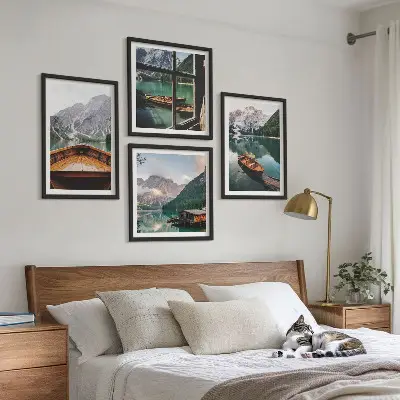 Set of 4 wall art pieces featuring a lake with mountains, boats, and a cottage window view