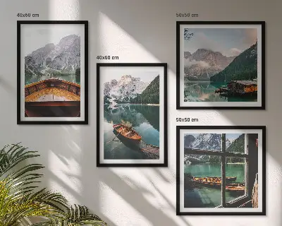 Set of 4 wall art pieces featuring a lake with mountains, boats, and a cottage window view