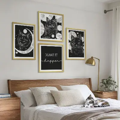 Wall art set featuring black cats, moon, and planet