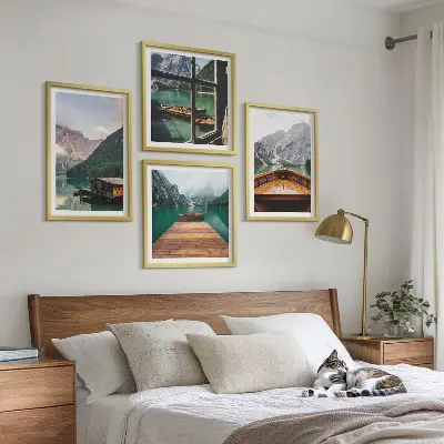 Multi-piece wall decor set featuring mountain landscapes, cottages, and boats