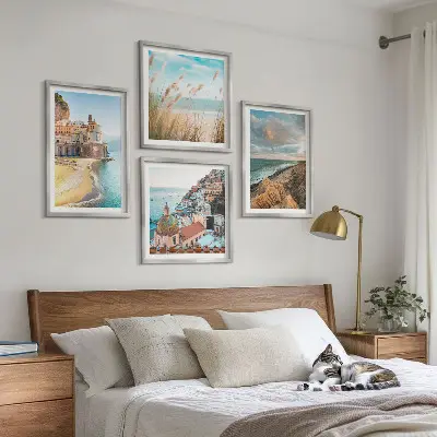 Set of 4 landscape wall art pieces featuring beach, city, and cliff scenes