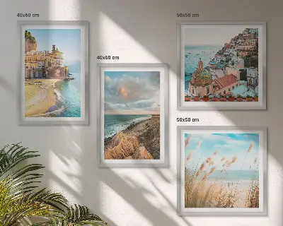 Set of 4 landscape wall art pieces featuring beach, city, and cliff scenes