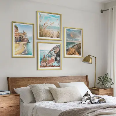 Set of 4 landscape wall art pieces featuring beach, city, and cliff scenes