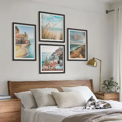 Set of 4 landscape wall art pieces featuring beach, city, and cliff scenes