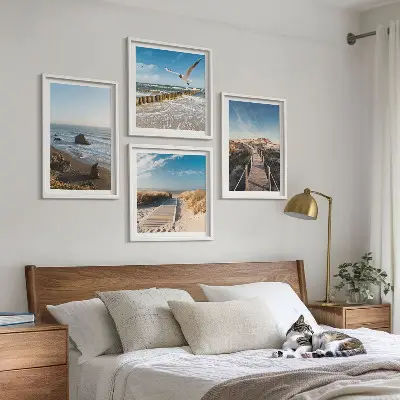Set of 4 wall art pieces featuring beach waves and a pier under the sky