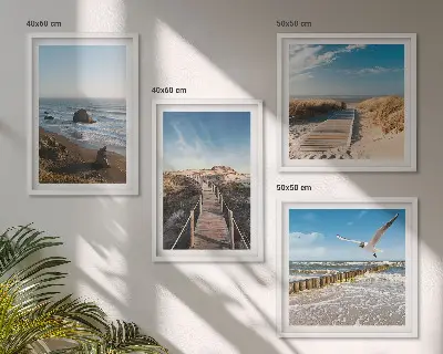 Set of 4 wall art pieces featuring beach waves and a pier under the sky