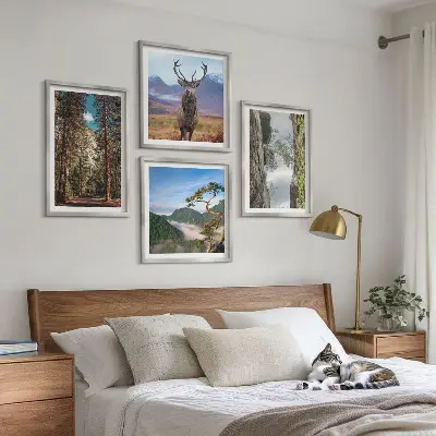 Set of 4 wall art pieces featuring a road through a forest with mountains and deer