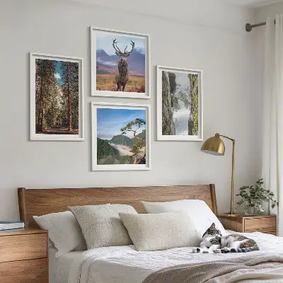 Set of 4 wall art pieces featuring a road through a forest with mountains and deer