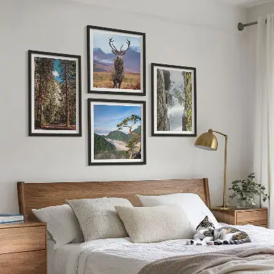 Set of 4 wall art pieces featuring a road through a forest with mountains and deer