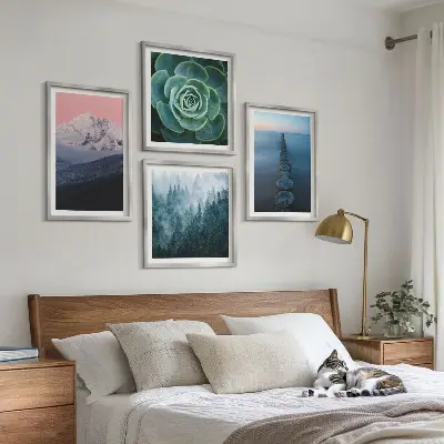 Wall art set featuring a mountain landscape with a pink sky, water, and succulents