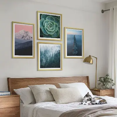 Wall art set featuring a mountain landscape with a pink sky, water, and succulents