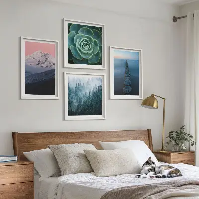 Wall art set featuring a mountain landscape with a pink sky, water, and succulents