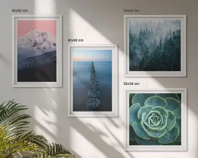 Wall art set featuring a mountain landscape with a pink sky, water, and succulents