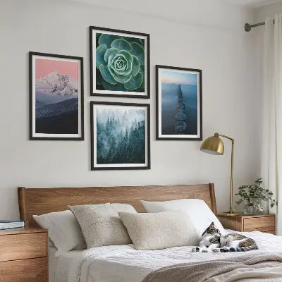 Wall art set featuring a mountain landscape with a pink sky, water, and succulents