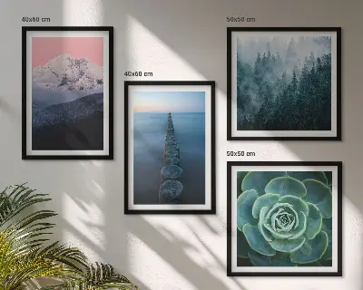 Wall art set featuring a mountain landscape with a pink sky, water, and succulents