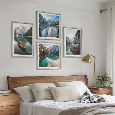 Wall art set featuring a lake with mountains, boats, and a cottage