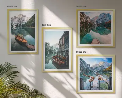 Wall art set featuring a lake with mountains, boats, and a cottage